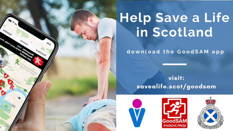 An image of a man An image with an outdoor background, showing two people: one lying down and the other performing CPR. At the forefront of the image is a hand holding a smart phone with the GoodSam map on it. The text block reads: Help save a life in Scotland, download the Good Sam app, visit savealife.scot/goodsam. Below the text block are logos of Save a Life for Scotland, Good Sam and the Scottish Ambulance Service.